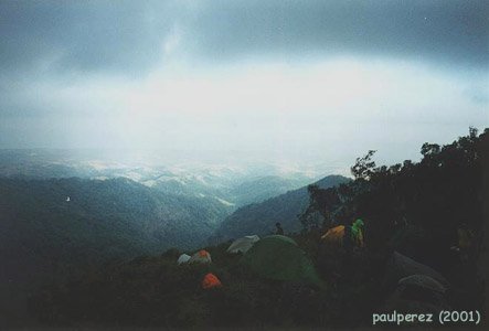 View from Ridge. Background is the mountain ranges in Bataan and farther is the
bataan shoreline. Campers adapting to the high velocity wind.
Cooking is a challenge and we positioned the tent with the back part
facing the wind.
Photo by:: paulperez (2001)