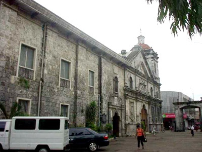 The Santo Ni?o Shrine as popularly known, was the Church of San Agustin before the title
Basilica Minore del Sto. Ni?o was conferred to it in 1965 during the 4th centennial of
Christianity in the Philippines. It
is among the most important religious pilgrim destinations of the Philippines. This
church marks the seat of the Christianization of the country, which took place in 1565
with the conversion to the Christian faith of Rajah Humabon, the king of Cebu at that
time, and his wife Queen Juana. (Various accounts as to the year of conversion of the
first Christian Filipinos are confusing. Another account points out that the baptism
occurred when Magellan planted in 1521 his now famous cross.)
Photo by:: GBLontok (2002)